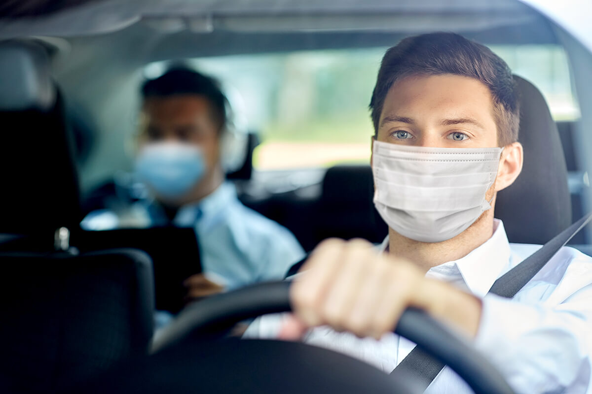 Ride share driver and passenger wear masks