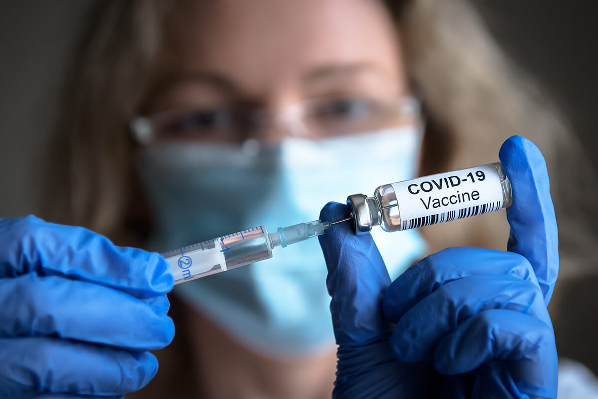 Medical professional holds COVID-19 vaccine