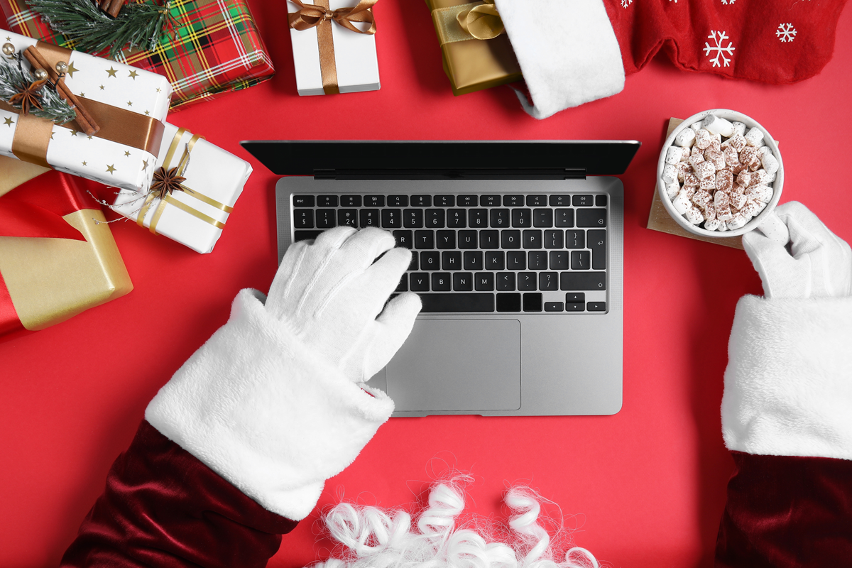 Santa typing on his laptop