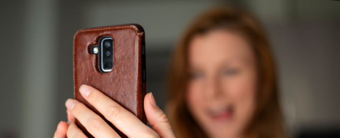 Woman shooting vertical video with her phone